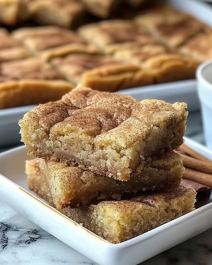 Chewy snickerdoodle cookie bars with cinnamon sugar topping