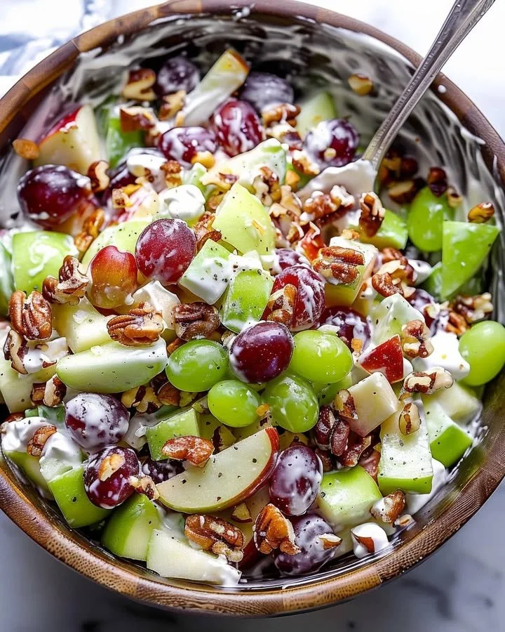 Classic Waldorf Salad with apples, walnuts, and celery in creamy dressing