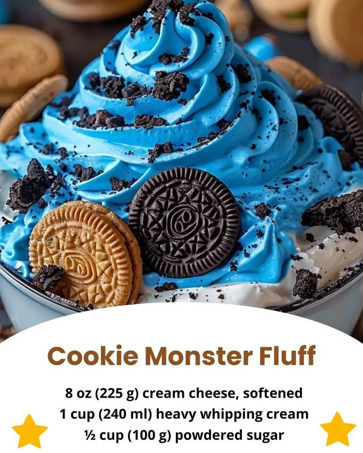 Bowl of Cookie Monster Fluff dessert with blue whipped cream and cookie pieces