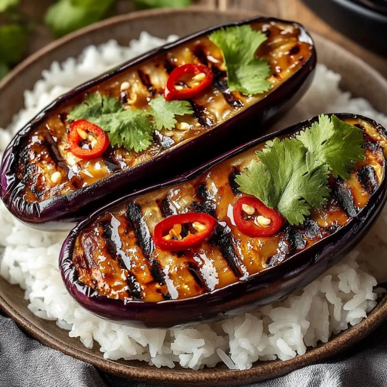 Grilled miso eggplant garnished with green onions and sesame seeds