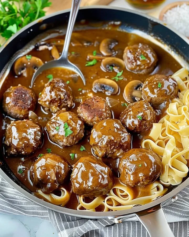 Gourmet meatballs in rich mushroom gravy served in a bowl