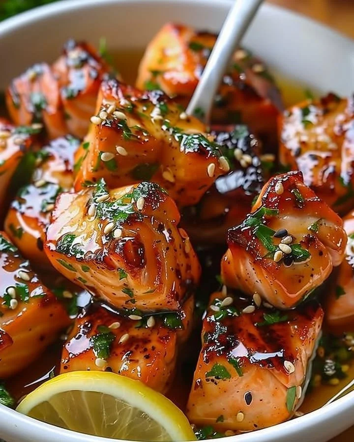 Honey butter garlic glazed salmon bites on a plate