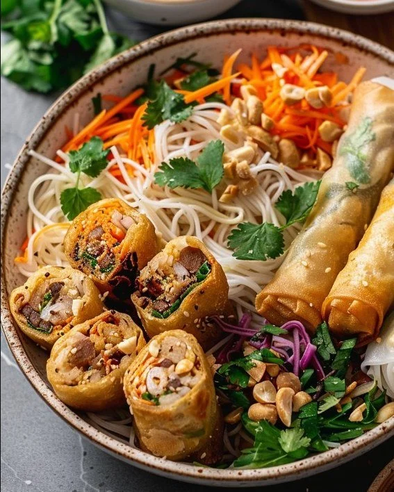 Thai Peanut Spring Roll Noodle Bowl with fresh vegetables and peanut sauce