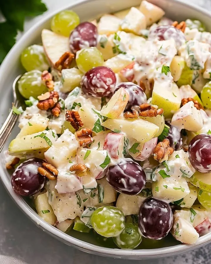 Delicious Waldorf Salad with apples, walnuts, and celery presented in a bowl.