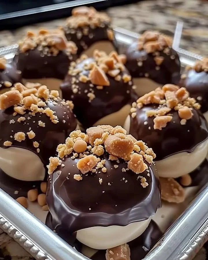 Delicious peanut butter cheesecake balls garnished with chocolate sprinkles