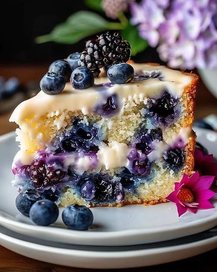 Moist cream cheese blueberry coffee cake with fresh blueberries and a crumbly topping