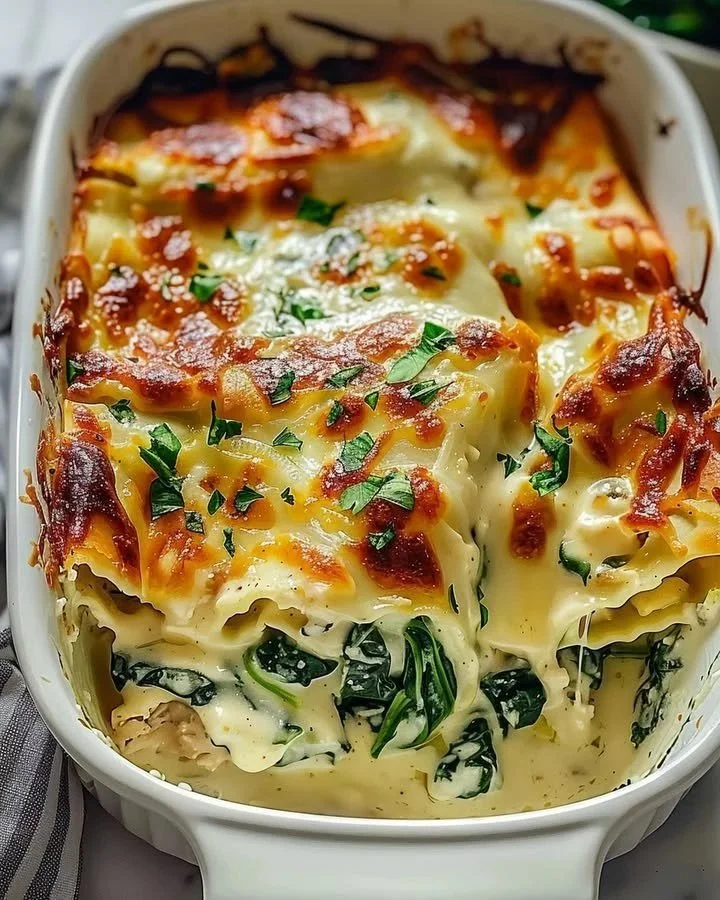 Cream Cheese Chicken Spinach Casserole baked in a dish, garnished with parsley.