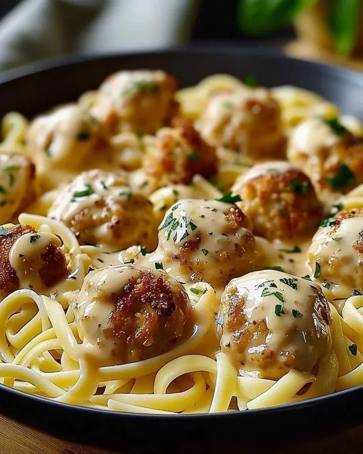 Creamy Parmesan Garlic Chicken Pasta topped with fresh herbs