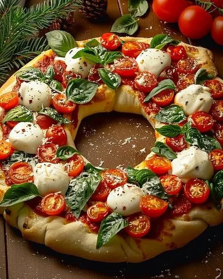 Festive Wreath Pizza with colorful toppings ready for the holidays.