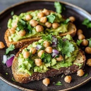 Sliced vegan avocado toast topped with protein-rich ingredients on a plate