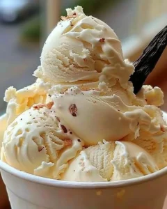 Homemade vanilla ice cream in a bowl with fresh ingredients