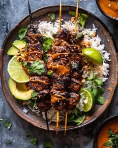 Zesty Thai Peanut Steak Skewers grilled to perfection with a flavorful peanut sauce